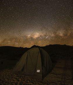 Tent against sky at night