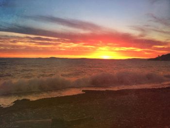 Scenic view of sea at sunset