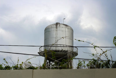 Low angle view of water tower against sky