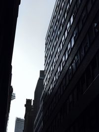 Low angle view of buildings against clear sky