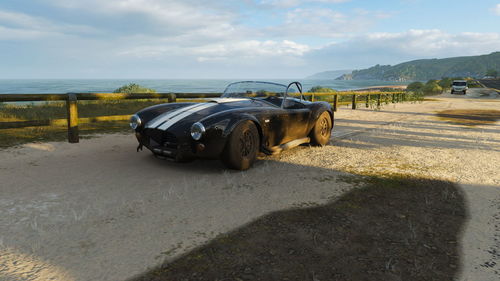 Vintage car on road during sunny day