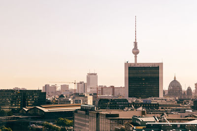 Fernsehturm in city against clear sky