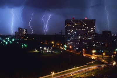 Lightning over city against at night