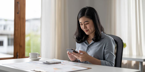 Young businesswoman working at office