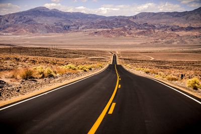 Road amidst landscape against sky