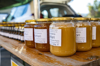 Close-up of beer on table at market stall