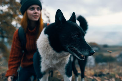Portrait of a dog on woman in winter