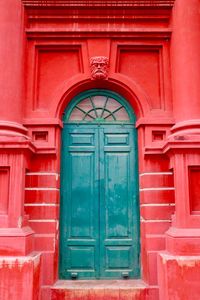 Closed door of red building