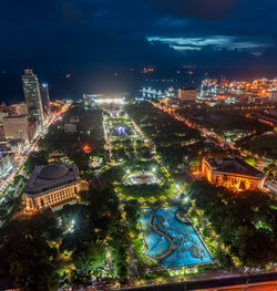 High angle view of illuminated buildings in city at night