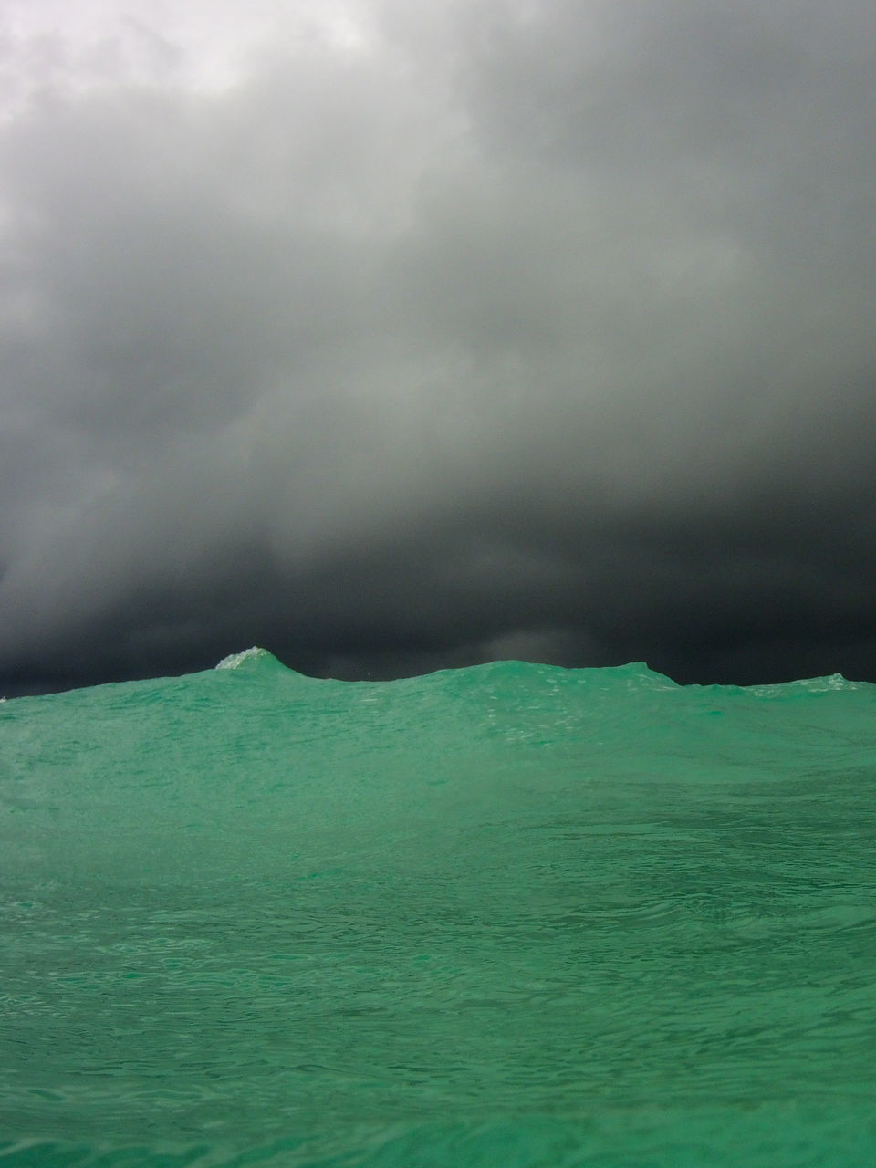 SCENIC VIEW OF SEA AGAINST DRAMATIC SKY