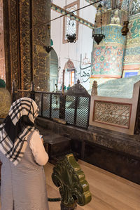 Rear view of woman in building at home