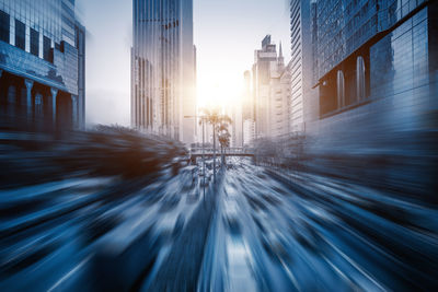 Blurred motion of street and buildings in city