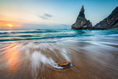 Scenic view of sea against sky at sunset