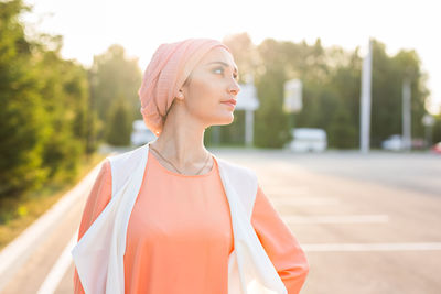 Portrait of a young woman looking away