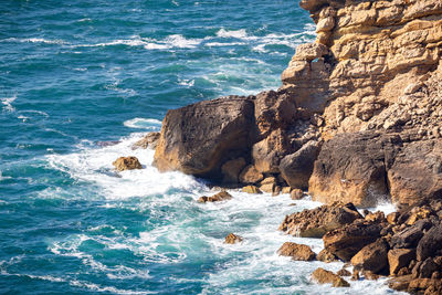 High angle view of rocks in sea