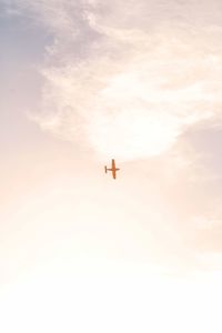 Low angle view of airplane in sky