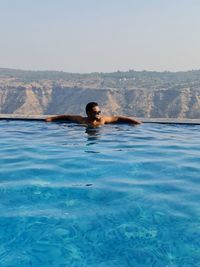 Man swimming in pool