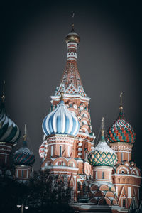 Illuminated buildings in city against sky