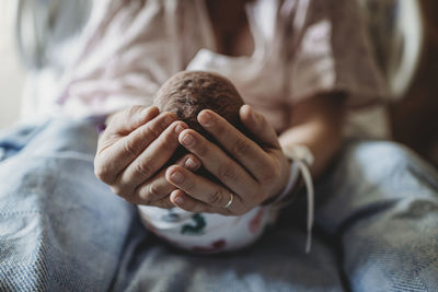 Close-up of woman holding hands