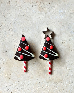 Chocolate christmas cake on stone table with decorations