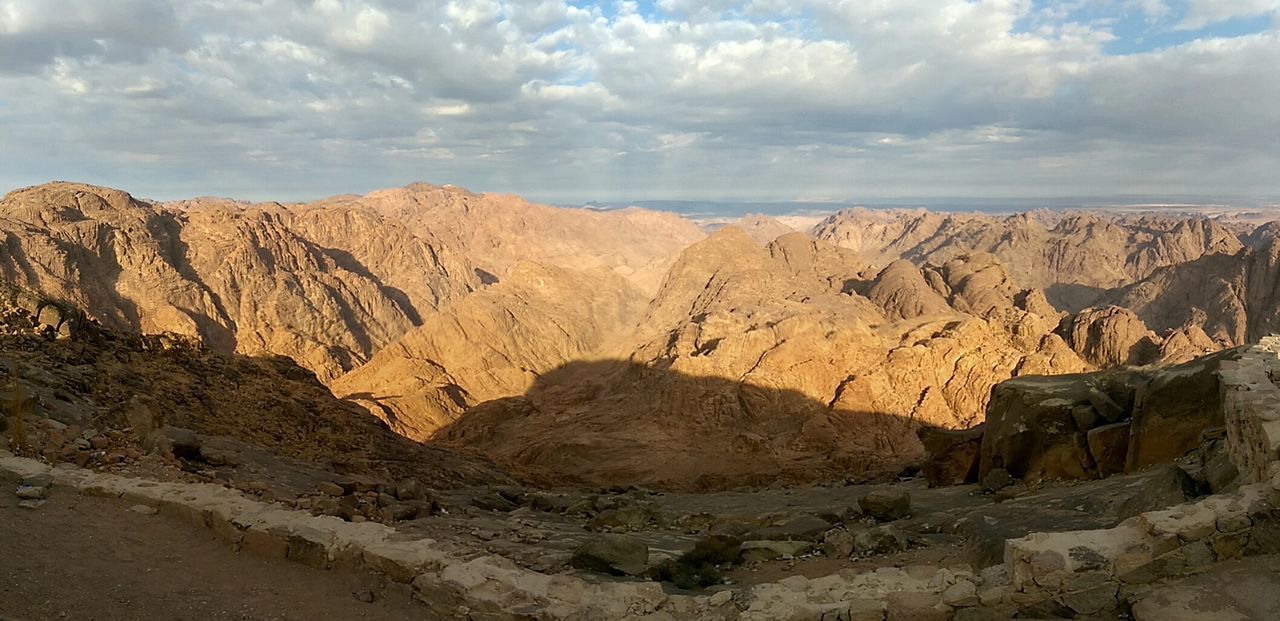 rock formation, sky, tranquility, tranquil scene, scenics, arid climate, beauty in nature, nature, geology, rock - object, landscape, physical geography, cloud - sky, desert, eroded, sand, cloudy, cloud, cliff, non-urban scene