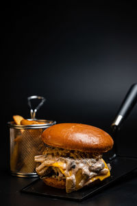 Close-up of food on table against black background