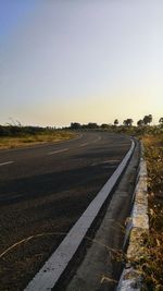 Empty road along landscape