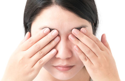 Close-up of a hand over white background