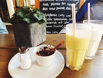 Cup of coffee with drink on table