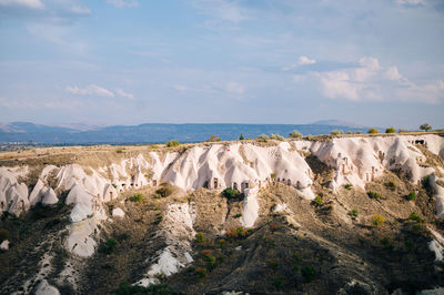 Panoramic view of sea and rocks against sky