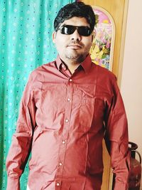 Young man wearing sunglasses standing outdoors