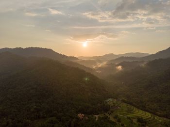 Scenic view of mountains against sky during sunset