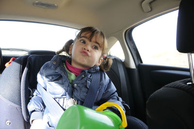 Girl sitting in car