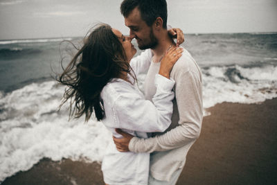 Couple standing on beach