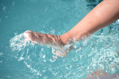 Low section of woman in swimming pool