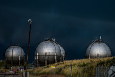 Storm clouds over crossbridge energy fredericia refinery, denmark