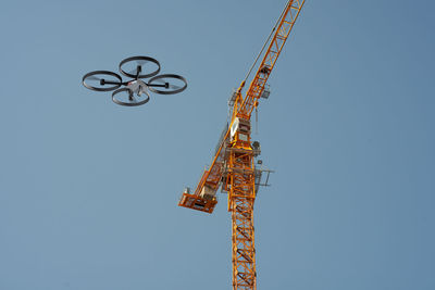 Drone inspecting a construction crane