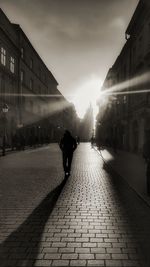 People walking on road in city