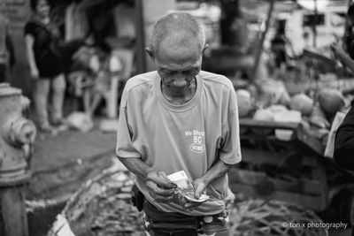 Midsection of man standing on street