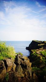 Scenic view of sea against cloudy sky