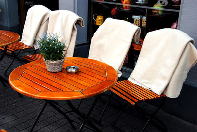 High angle view of empty chairs and table in restaurant