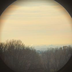 Scenic view of landscape against sky at sunset