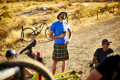 Mountain bikers having drinks after their ride.