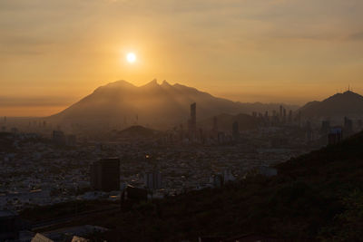 High angle view of townscape against sky during sunset