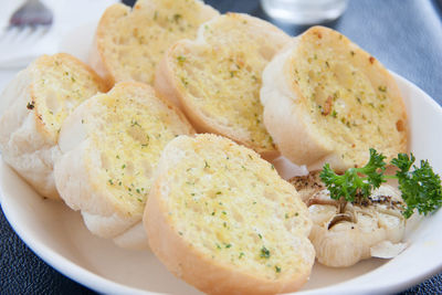 Close-up of breads in plate on table