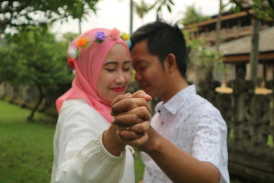 Young couple standing outdoors