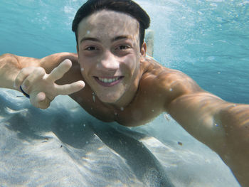 Portrait of man swimming in sea