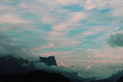 Low angle view of silhouette mountain against sky