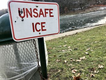 Close-up of warning sign on field