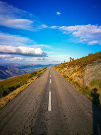 Road amidst landscape against sky